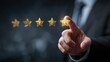 © Stocksy - Businessman giving five star rating by touching glowing icon