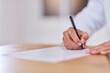 © bnenin - Professional Signing A Document: Close-Up Of Hand Writing On Paper With Pen