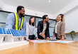 © PINA - team of multiethnic coworker meeting on solar roof system project with solar panel house model, responsibility of green industry alternative renewable clean environment energy for sustainable business