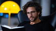 © Mselected - Man reading a book while relaxing in a modern indoor setting