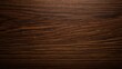 © Enigma - Dark ebony wood texture featuring a rich brown surface, natural horizontal grain patterns, and a smooth wooden background, ideal for decorative and design use