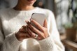© matucha12 - Woman using health app on smartphone with silver smart ring