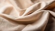 © Amy - natural beige linen fabric with soft waves and textural detail in macro view copy space