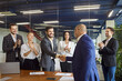 © Studio Romantic - Business people shaking hands on meeting in conference room, applause of happy team of office colleague in support of deal. Handshake of professional manager and businessman. Success agreement concept