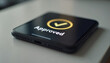 © AlenaSi - Approved phone rests on surface, showing approved message on screen. Approved message indicates successful verification process, displaying status updates.