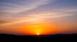 © RIDEC - Beautiful Sunset Over Mountains With Flying Birds and Vibrant Sky