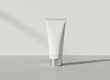 © mohdfaizal - Blank cosmetic cream tube mockup on minimal surface with shadow