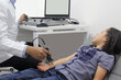 © Arlette - Electromyography EMG and Nerve Conduction Velocity NCV of the hand and arm in a 6-year-old Latina girl with a doctor