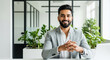 © Shivani - Confident Indian Businessman Smiling in Modern Office Setting