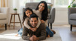 © Shivani - Happy Indian Family Posing Together in Modern Living Room