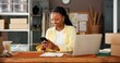 © peopleimages.com - Mobile, ecommerce and black woman in office for small business, fashion supply chain or online review. Logistics, phone and happy worker with delivery update, typing or reading email for distribution