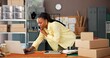 © Nina25/peopleimages.com - Phone call, boxes and black woman with laptop in office for ecommerce order confirmation. Tracking delivery, inventory and parcel with person in small business for shipping and supply chain courier