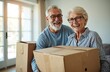 © Viktor - Happy senior couple moves in new home. Smiling pensioners carry cardboard box. Man and woman relocate to new apartment. Elderly family enjoying life together. Moving concept for seniors.