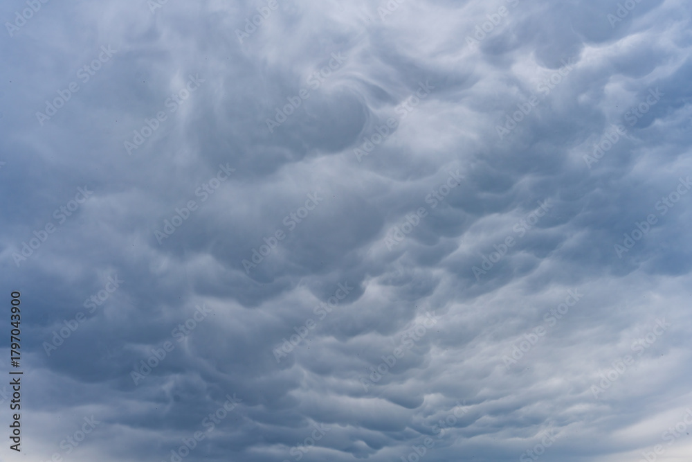 Mammatus clouds expand across the Bavarian sky displaying a rare ...