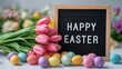 © vxnaghiyev - Text message board reading Happy Easter beside a vibrant bouquet of pink tulips and colorful plastic Easter eggs, festive spring celebration