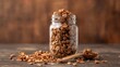 © TheWaterMeloonProjec - Granola displayed in a glass jar with a wooden spoon, fiber-dense choice