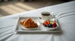 © Octopus16 - Fresh Breakfast with Croissant Fruit and Coffee on Bedside Tray