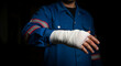 © fia - Injured worker with bandaged hand, highlighting workplace safety and accident prevention