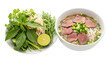 © xbzz - Fresh herbal ingredients and a bowl of traditional Vietnamese pho soup with sliced beef, noodles, green onions, and herbs on a white plate