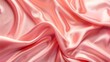 © Ummeya - Close up of draped light pink silk fabric with soft folds and glossy sheen creating abstract patterns