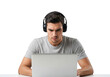 © sujon1638 - Young man wearing headphones intently focused on a laptop screen with a serious expression isolated on transparent background