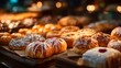 © horizon - Lavish and abundant display of assorted fresh pastries on a bakery counter, including beautifully detailed croissants, danishes, and cinnamon rolls.