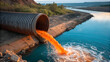 © Pramod - Industrial pipe discharging toxic orange wastewater into a clear blue river, water pollution, environmental contamination, chemical spill.