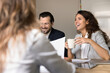 © fizkes - Diverse workers share opinions on casual briefing in friendly atmosphere