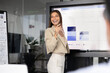 © fizkes - Happy young female business product manager presenting analytic data