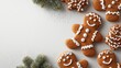 © Johannes - top view of decorated christmas gingerbread man cookies on white table background with copy space concept of holiday celebration merry christmas xmas concept