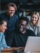 © Johannes - diverse multiracial young happy cheerful coworkers business startup creative team people students discussing project results with african american mentor leader in contemporary office using laptops n