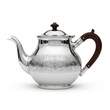© Veroza - Elegant teapot adorned with delicate etched ornamentation and featuring a graceful spout