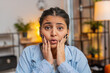 © Andrii Iemelianenko - Portrait of stress offended woman boring dissatisfied looking at camera shake head no rejection deny. Indian girl bored with work home office student stressful sad upset annoyed grimace. Lifestyle.