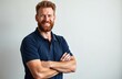 © miss irine - Bearded man with blue polo and arms crossed smiles happily. Professional portrait, isolated on white, copy space. Business, expertise, male model.
