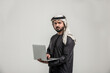 © oneinchpunch - Arab man wearing emirati clothing posing in studio - Handsome middle-eastern businessman portrait