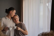 © Ina - Intimate morning moment: a loving mid-age couple enjoying coffee by the window, sharing a quiet connection and peaceful domestic routine.