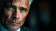 © AdorStudios - successful mature businessman with confident expression showcasing authority strategy and professional achievement