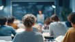 © Paula - University students attending classroom lecture from back view