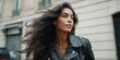 © Andrii Zastrozhnov - Young hispanic female with flowing hair wearing black leather jacket outdoors