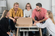 © Volodymyr - Group of friends sitting together excited to open pizza boxes. Laughter and joy fill the room as they share food. Pizza with smiles and fun. Friends enjoying delicious pizza during a cozy evening.