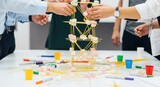 Team collaboration building marshmallow spaghetti tower challenge