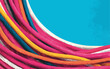 © LeNo - Fascio di cavi colorati su sfondo blu brillante, simbolo di connessione e comunicazione.