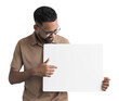 © kite_rin - Young man holding blank white board for advertise text isolated transparent PNG, Joyful cheerful casual businessman showing billboard with mockup empty space