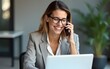 © car - Happy smiling mature middle aged business woman, 40s professional lady executive manager talking on the phone making business call on cellphone at work in office using laptop. High quality