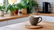 © Nataliia_Trushchenko - A mug of coffee sits on a coaster on a wooden table. The steam from the coffee rises and fills the air. The scene is cozy and inviting, with the warmth of the coffee