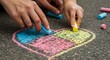 © O - Man and child hands drawing a colorful heart on asphalt with chalk. Creative family activity and fun time together outdoor concept.