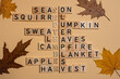 © ADDICTIVE STOCK - Wooden block crossword featuring autumn related words