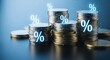 © ZHMPRO - Stacks of coins with percentage symbols floating above them, symbolizing interest rates, financial growth, and investment opportunities