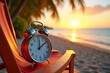 © Vera - Vintage alarm clock placed on a colorful deck chair, with a breathtaking tropical beach view at sunrise.