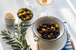 © ADDICTIVE STOCK - Greek olives and wine in an elegant tabletop setting